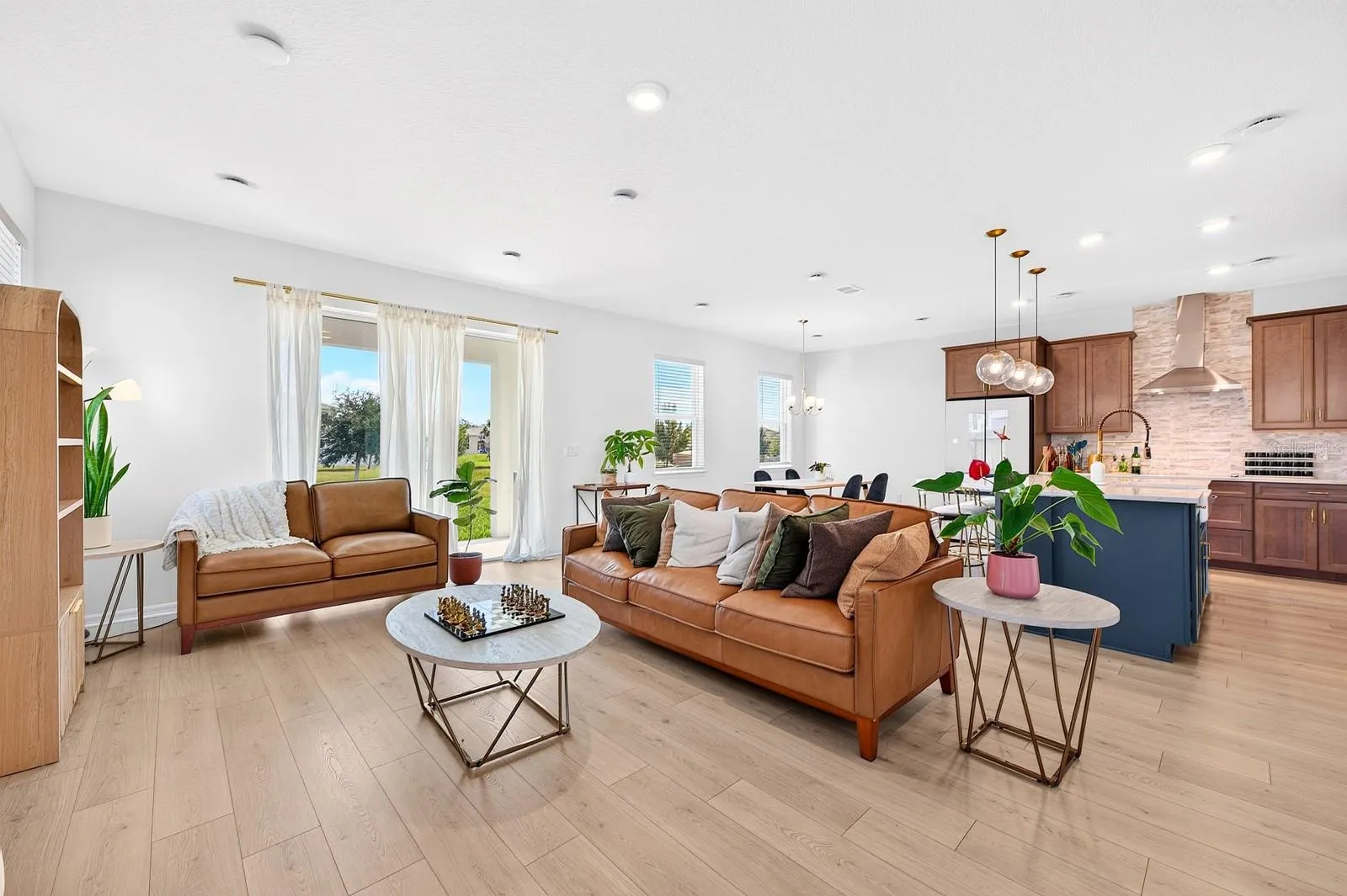A bright, inviting interior features LUXURY VINYL PLANK FLOORING throughout.