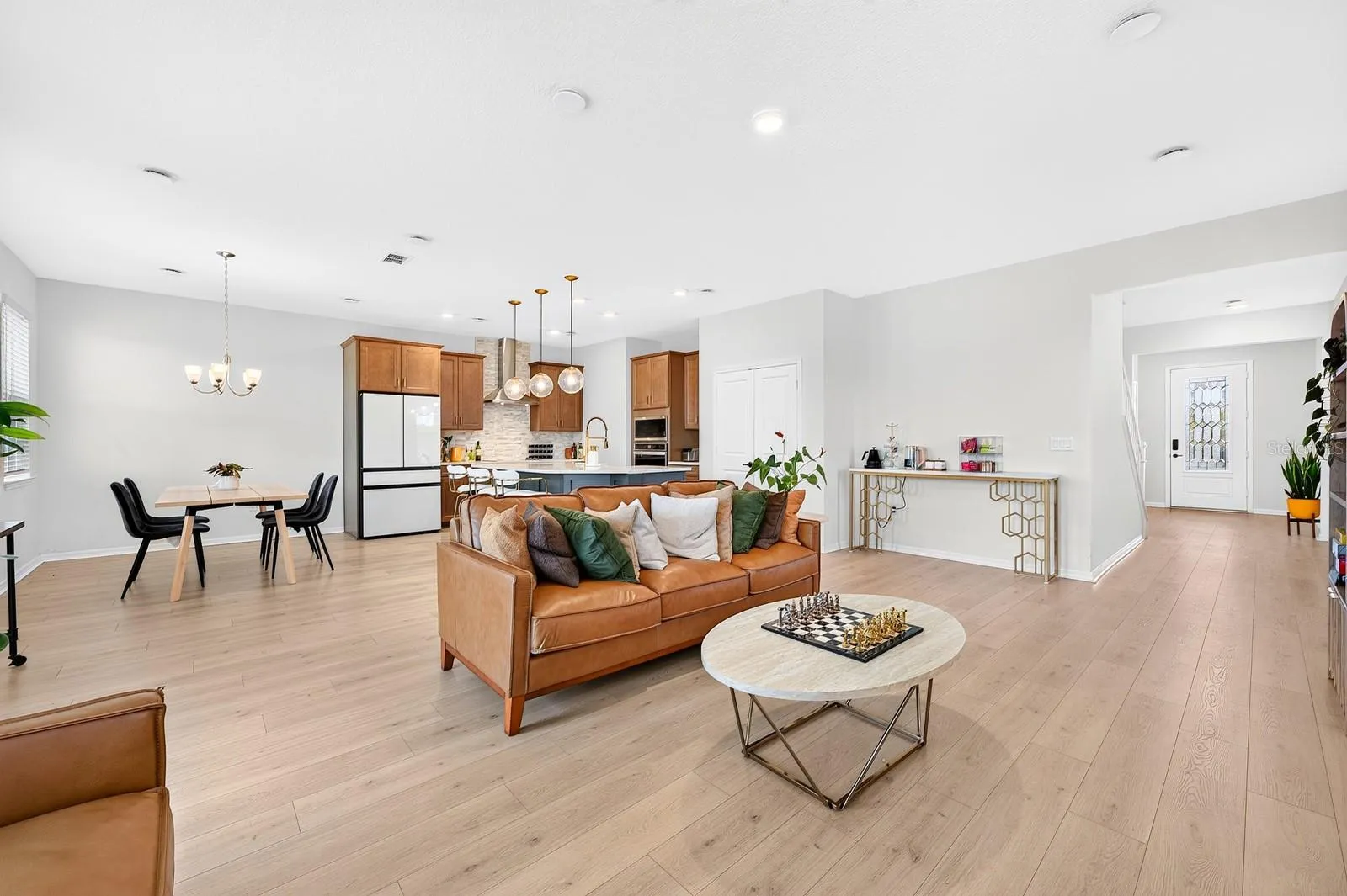 The OPEN-CONCEPT FLOOR PLAN seamlessly connects the Living Room, Dining Room and Kitchen, creating an ideal setting for everyday living and entertaining.
