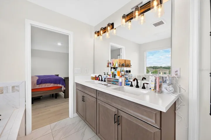 The Primary en suite Bath boasts DUAL SINKS, a GARDEN TUB, separate STEP-IN SHOWER and PRIVATE WATER CLOSET.