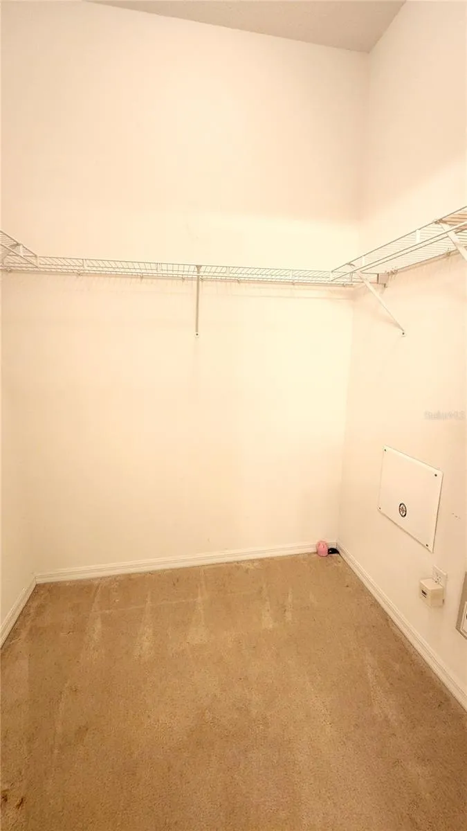 Large walk-in closet in primary bedroom.