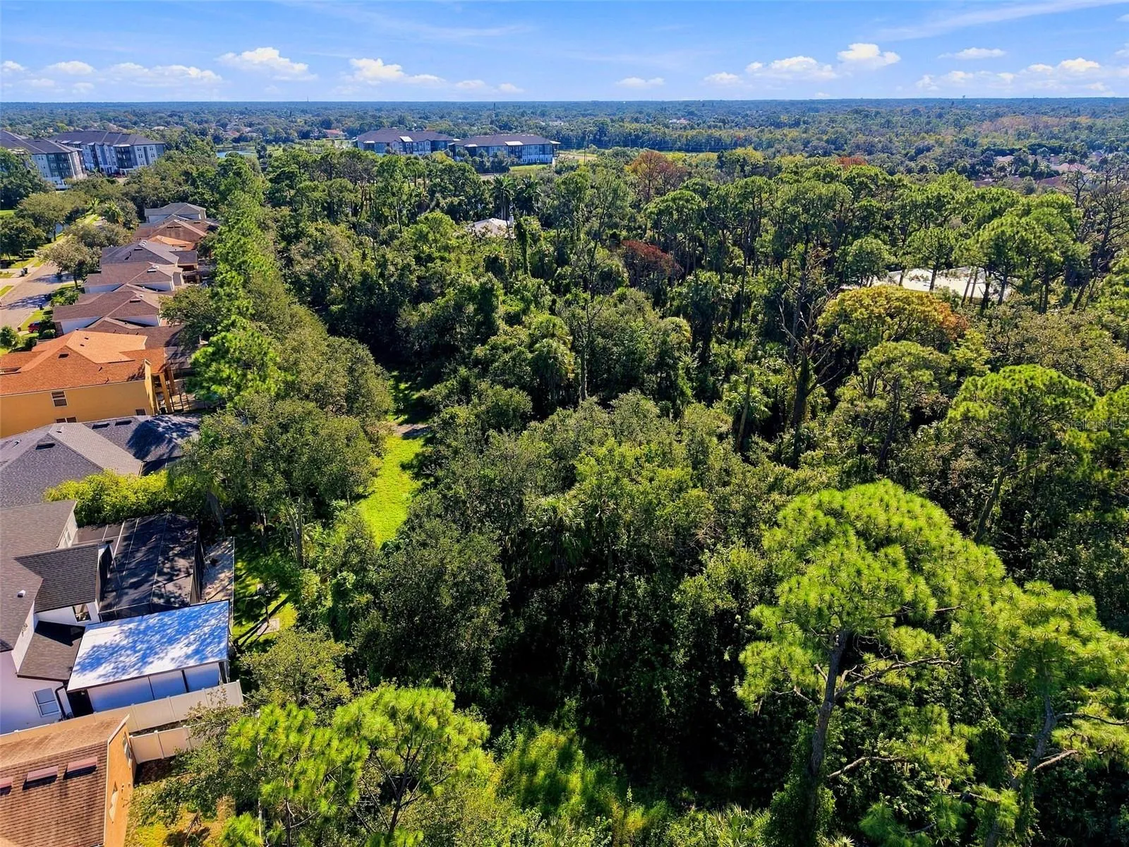 View of green area at start of ingress to parcel on 68th Ave E - private road