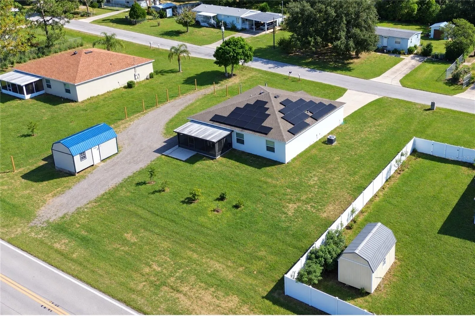 Aerial view of the property and its surroundings from another angle.