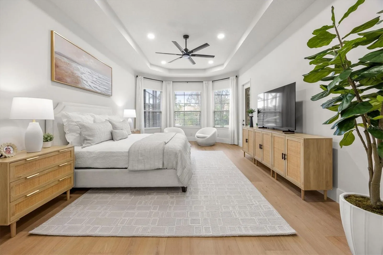 Primary Suite Bedroom and Seating Area