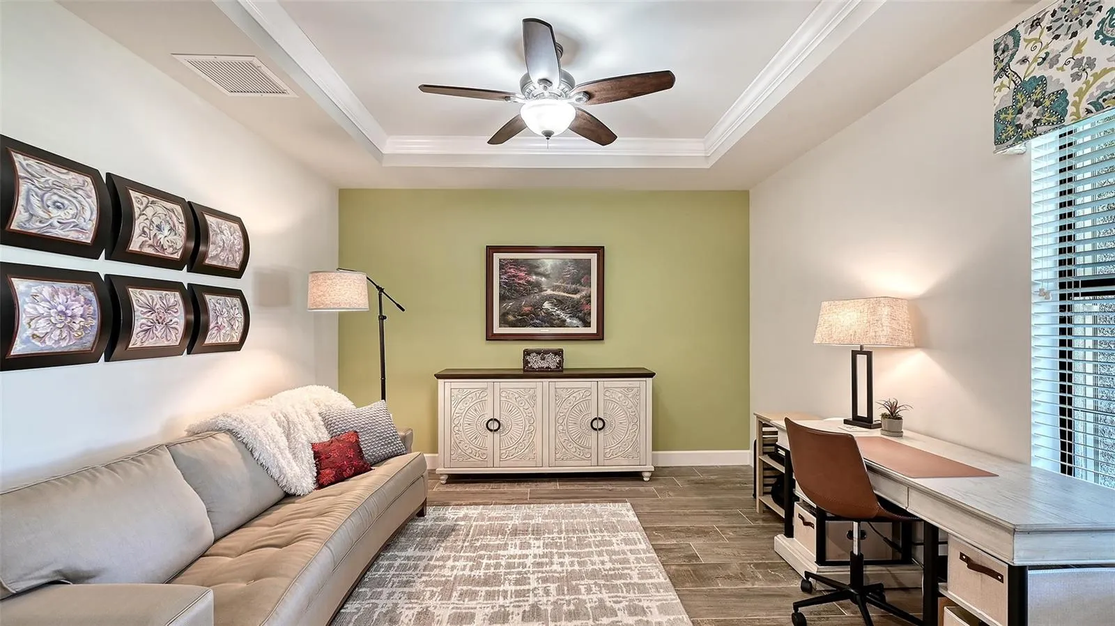 Study/Den in the front of the home with a tray ceiling gives you privacy to work from home or enjoy this room as a den.