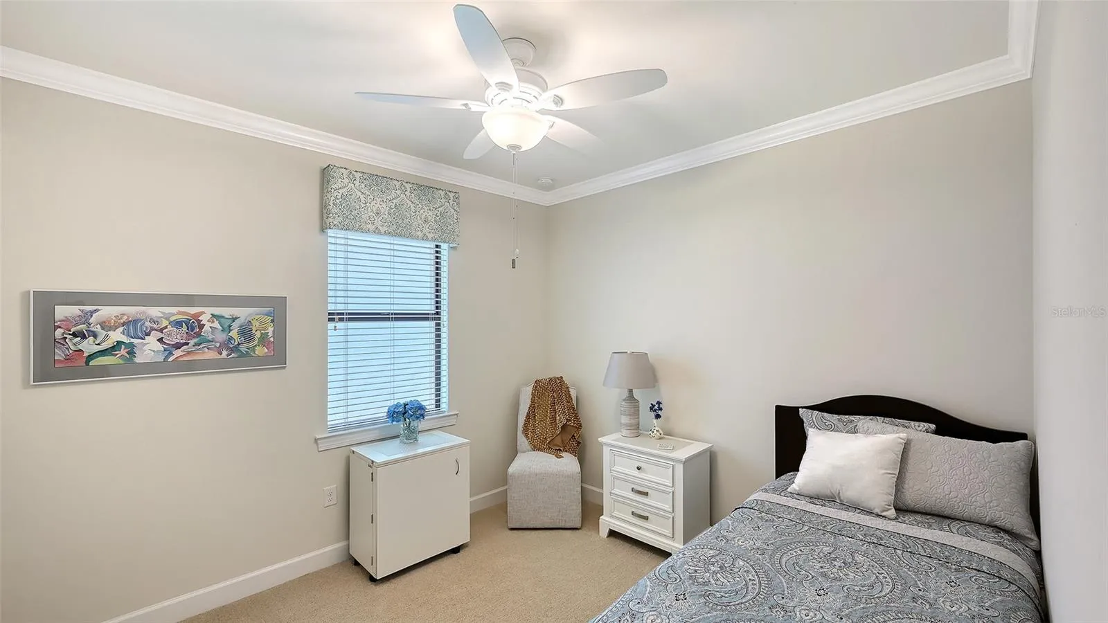 Third bedroom with a large walk-in closet that is positioned in the home for privacy.
