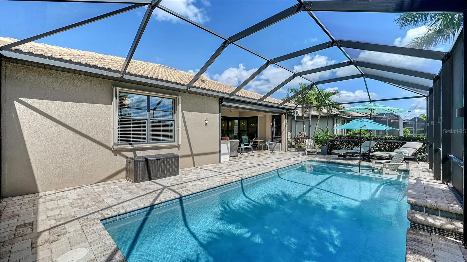 Enjoy leisurely afternoons lounging beneath the covered lanai.