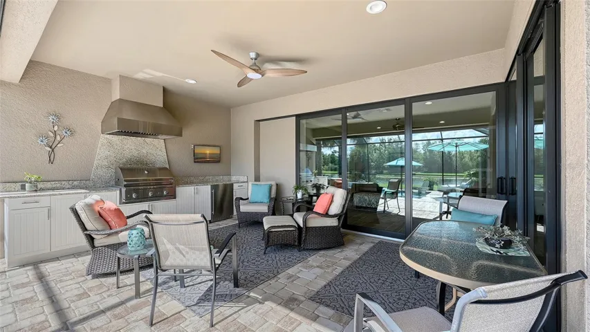 Entertain guests, host a delightful cookout, or simply unwind poolside as the sparkling pool shimmers in the sunshine.