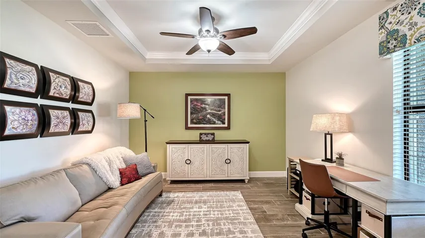 Study/Den in the front of the home with a tray ceiling gives you privacy to work from home or enjoy this room as a den.