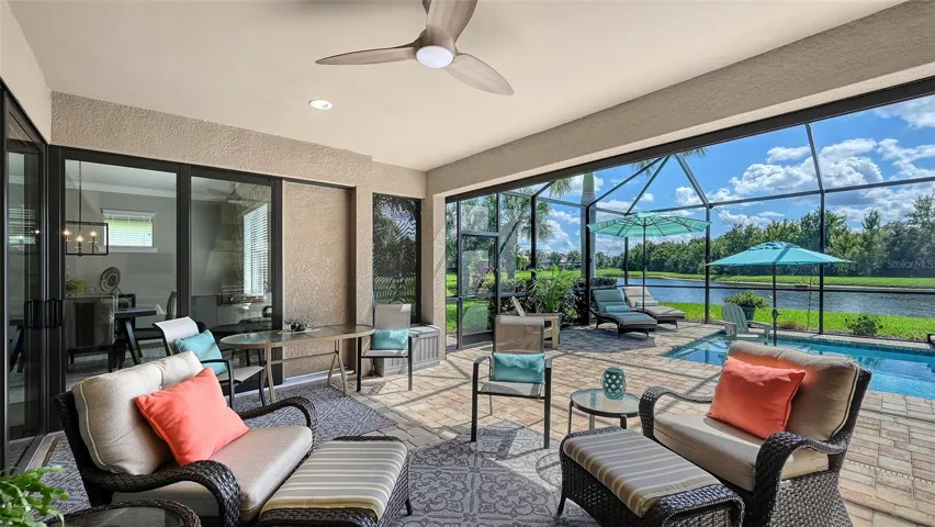 Step into your own outdoor oasis, where covered seating, a well-appointed outdoor kitchen, and breathtaking views create the perfect backdrop for Florida living.