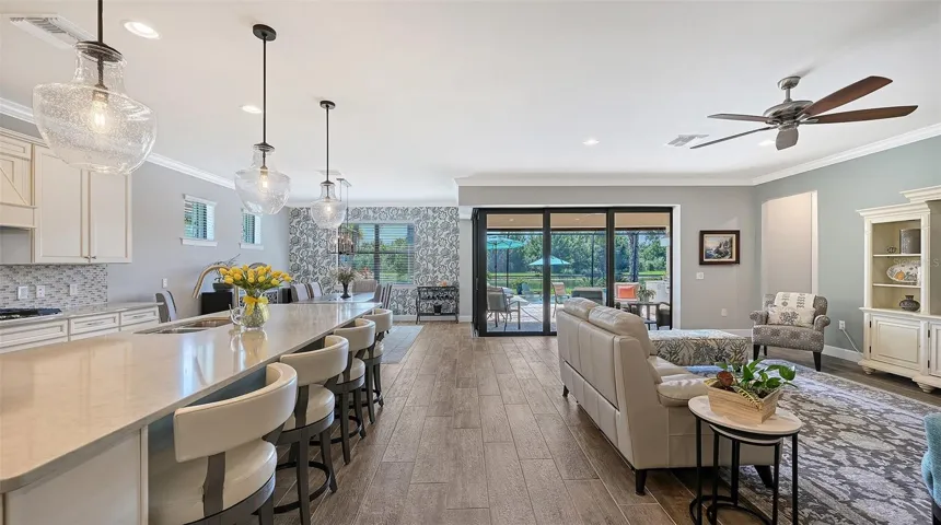 Step inside to discover an inviting great room and stunning kitchen gathering area, thoughtfully designed for everyday comfort and effortless entertaining.