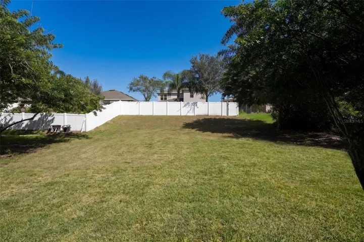 Additional yard space beyond the existing fence