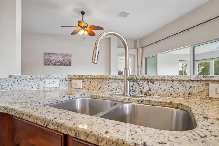 Kitchen Sink with New Faucet and Granite Countertops