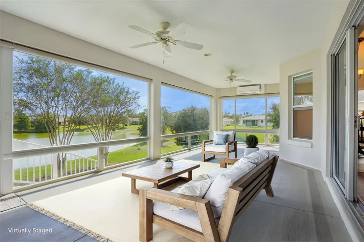 Virtually Staged Enclosed Lanai with Panoramic Water View