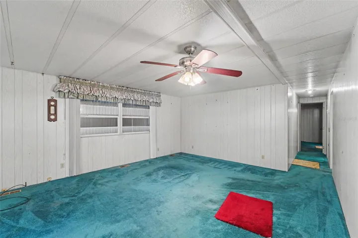 Large Living area - hurricane shutters are down and seen through the windows