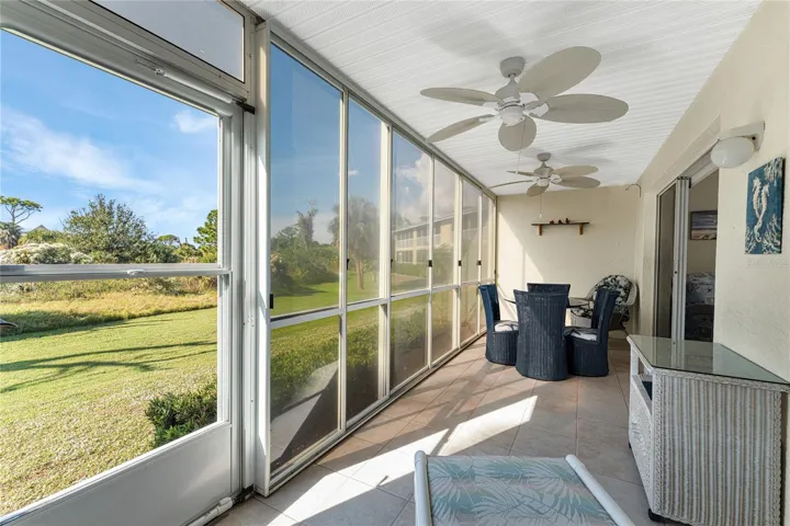 Vinyl enclosed lanai overlooks Wildflower Preserve.