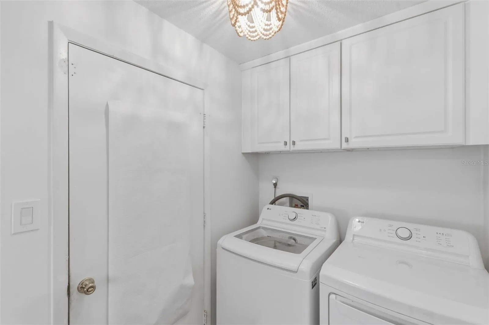 Laundry room with upper cabinets. Washer &  Dryer 2025