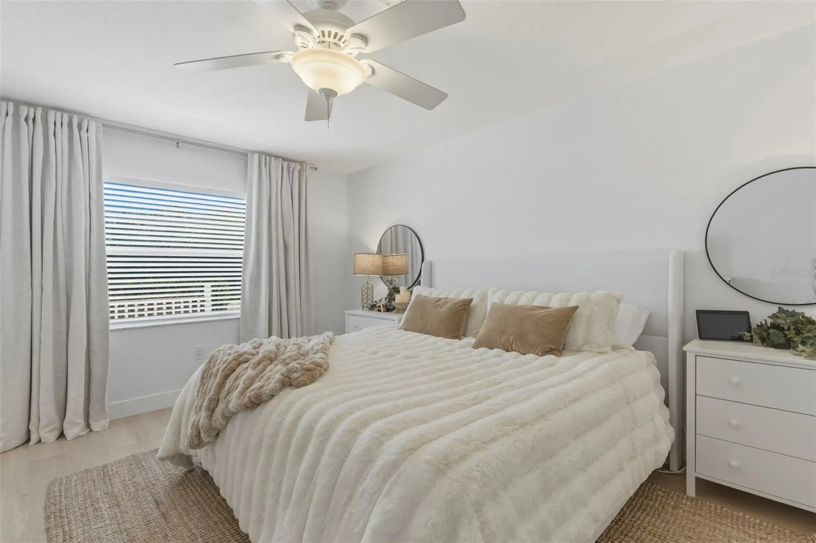 Primary bedroom, light and bright with darken curtains. Plenty big for a King size bed set.