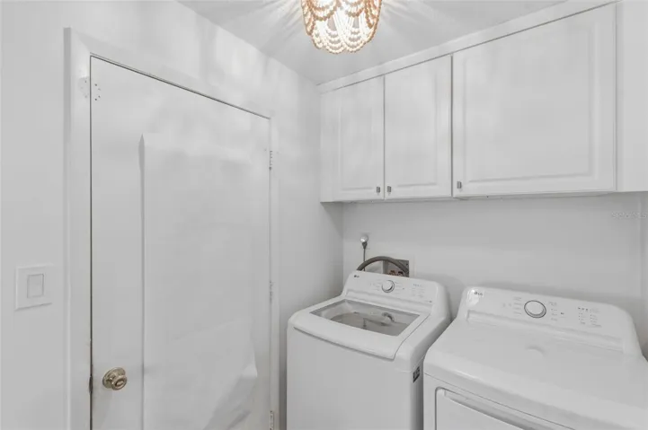 Laundry room with upper cabinets. Washer &  Dryer 2025