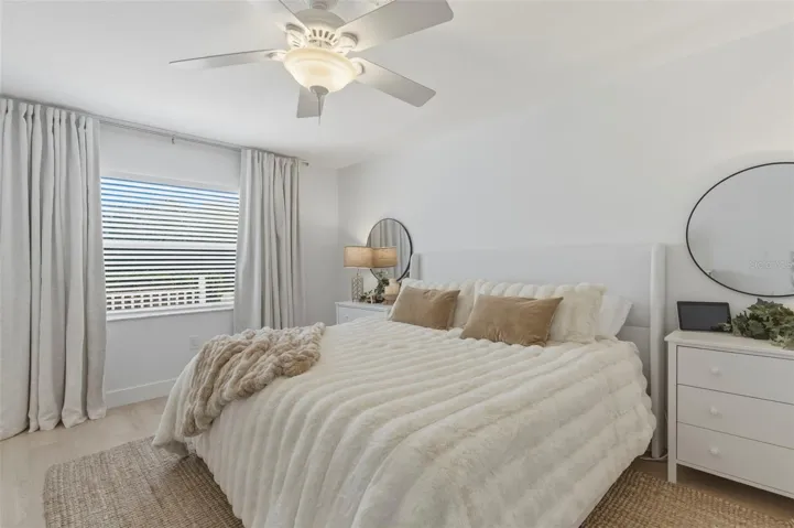 Primary bedroom, light and bright with darken curtains. Plenty big for a King size bed set.