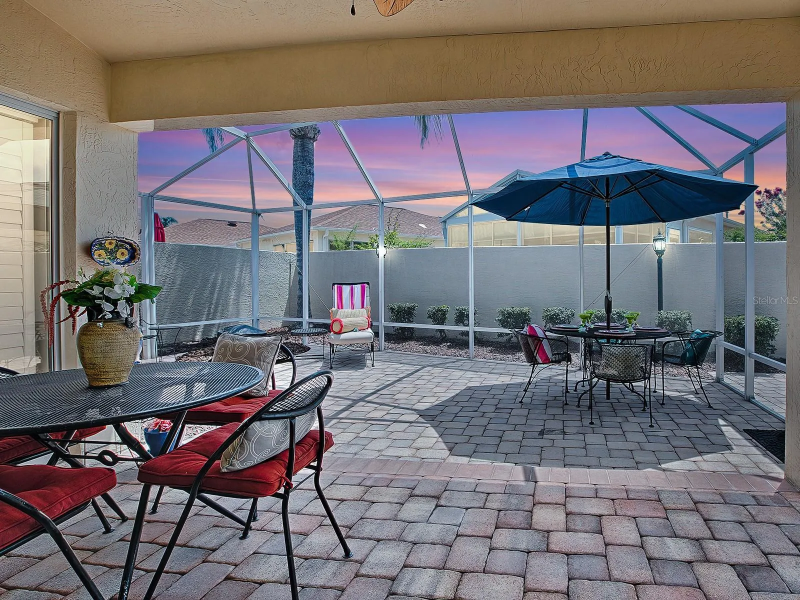 Covered lanai and huge birdcage area (furniture shown for staging purposes only)