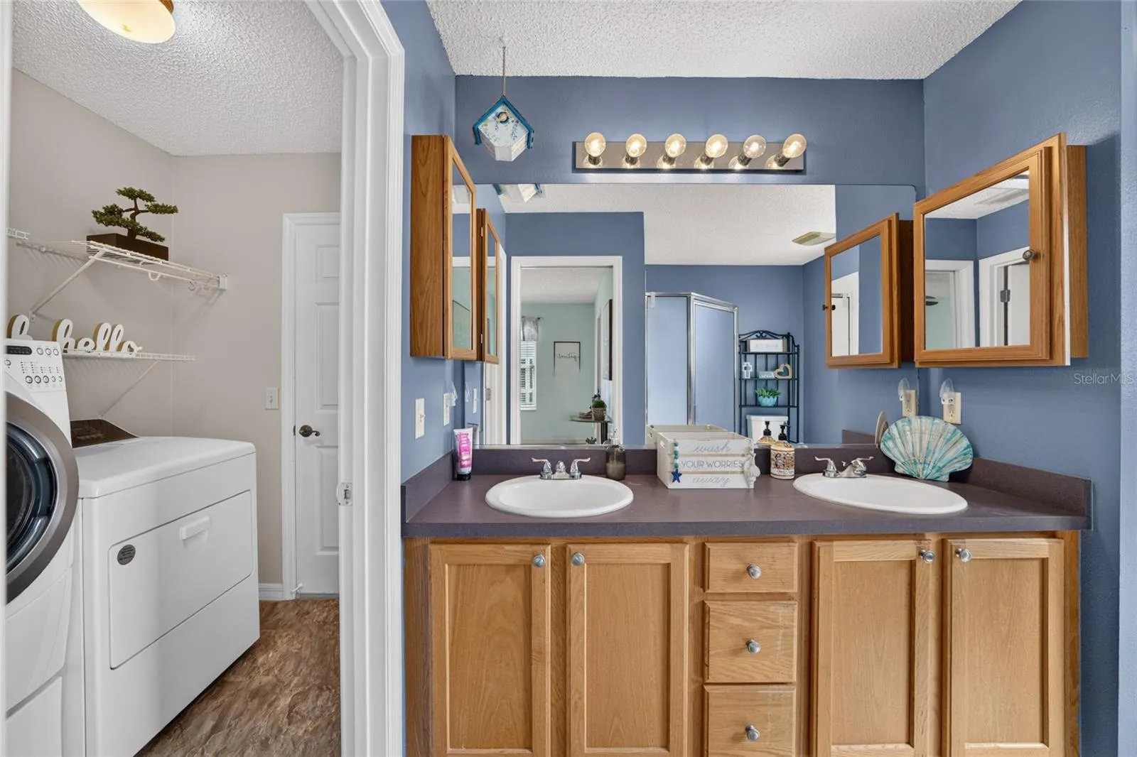 PRIMARY BATH WITH ENTERENCE TO LAUNDRY ROOM TO GARAGE