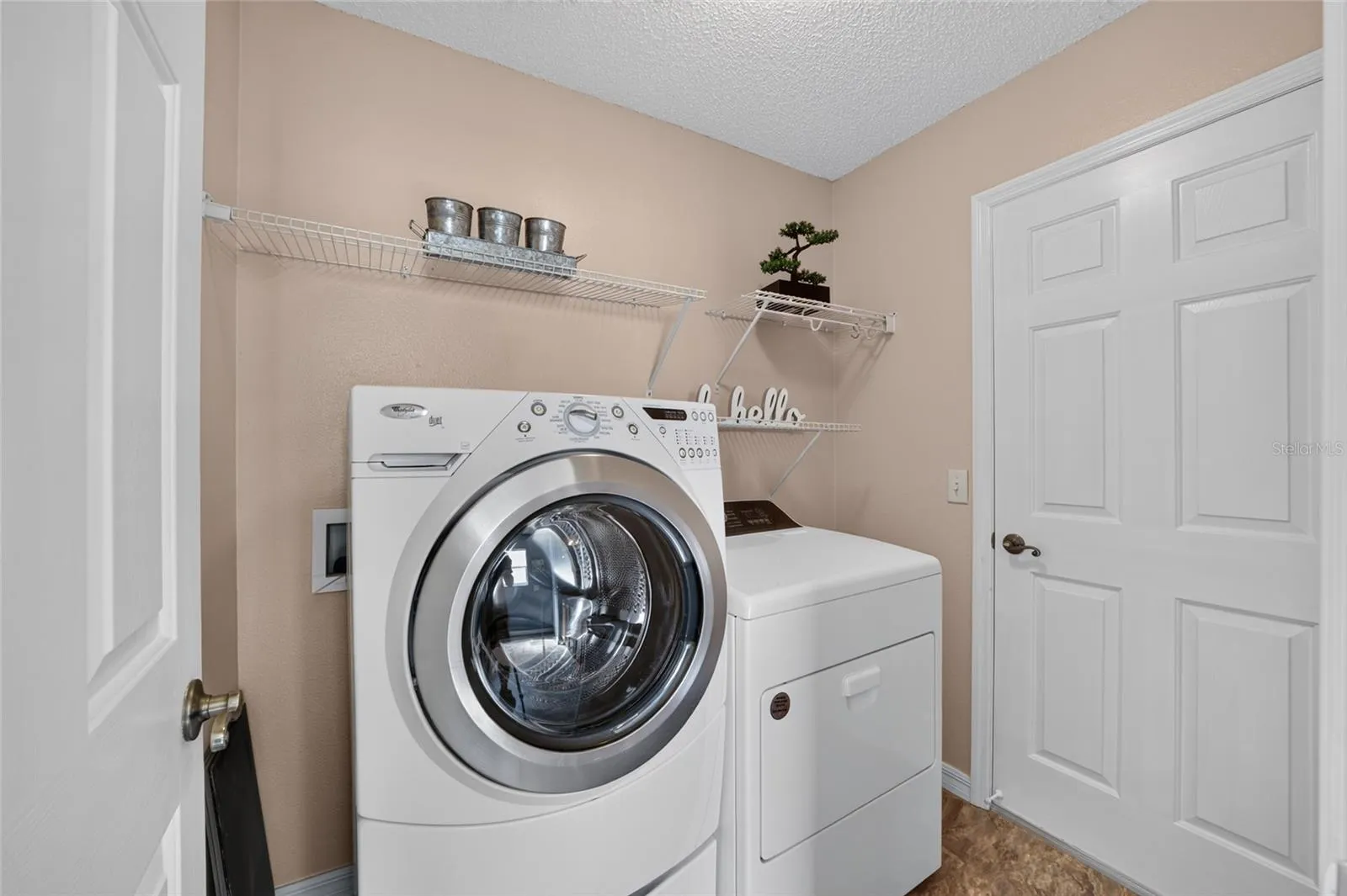 LAUNDRY ROOM OFF PRIMARY BATH TO GARAGE