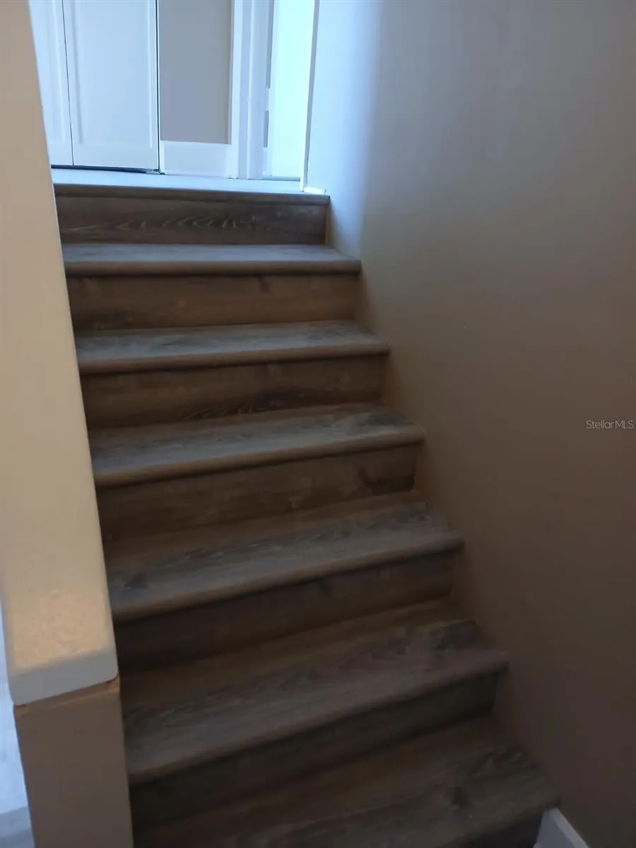 Stairs and upper-level carpet have been replaced with LVP