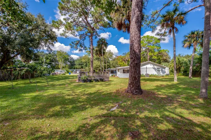 Large back yard and adjacent lot convey or can be split.