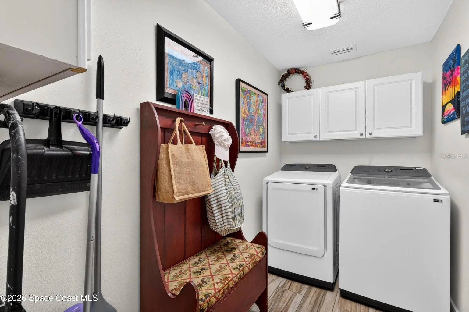 Laundry room with cabinet storage