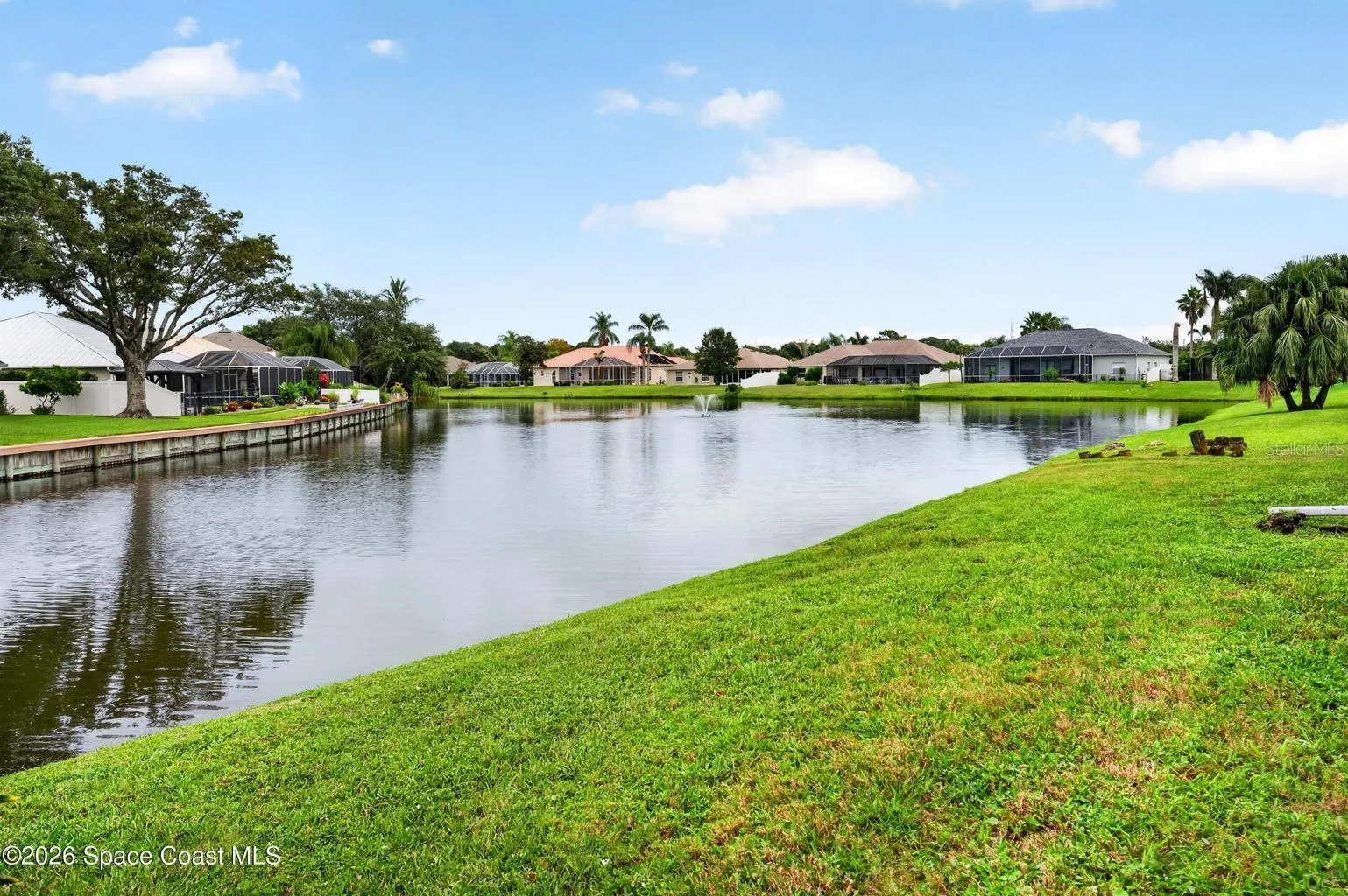 Lakefront backyard with open views