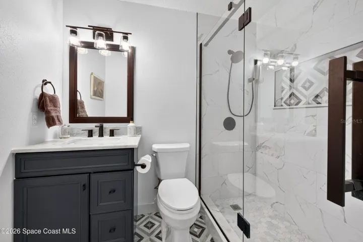 Updated bath with frameless shower