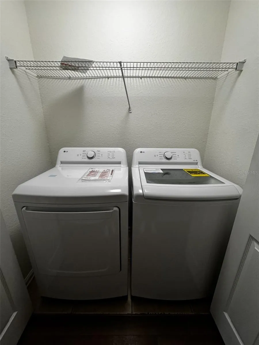 Convenient interior laundry area with washer and dryer.