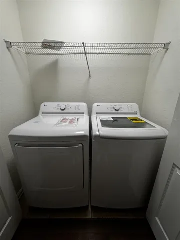 Convenient interior laundry area with washer and dryer.