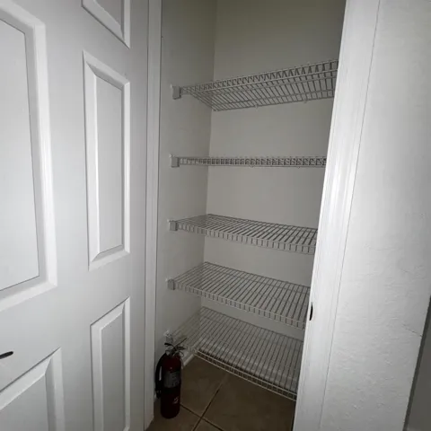 Large pantry offering excellent additional storage.