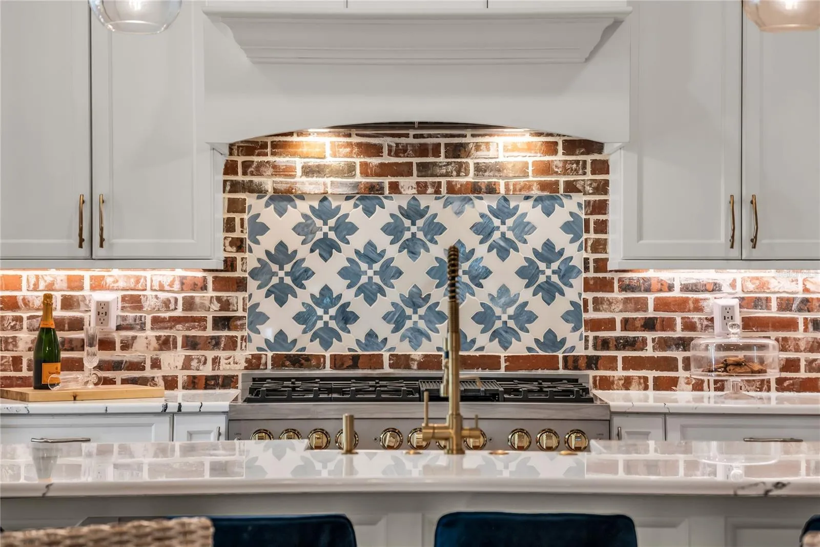 The chef's kitchen is a true focal point with a distinctive mix of old-world charm and modern design that combine luxury and function