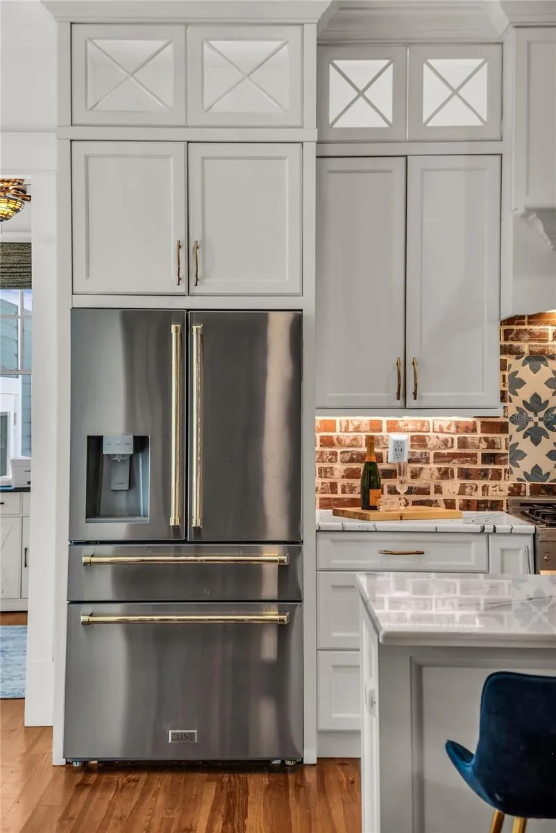 The chef's kitchen is a true focal point with a distinctive mix of old-world charm and modern design that combine luxury and function