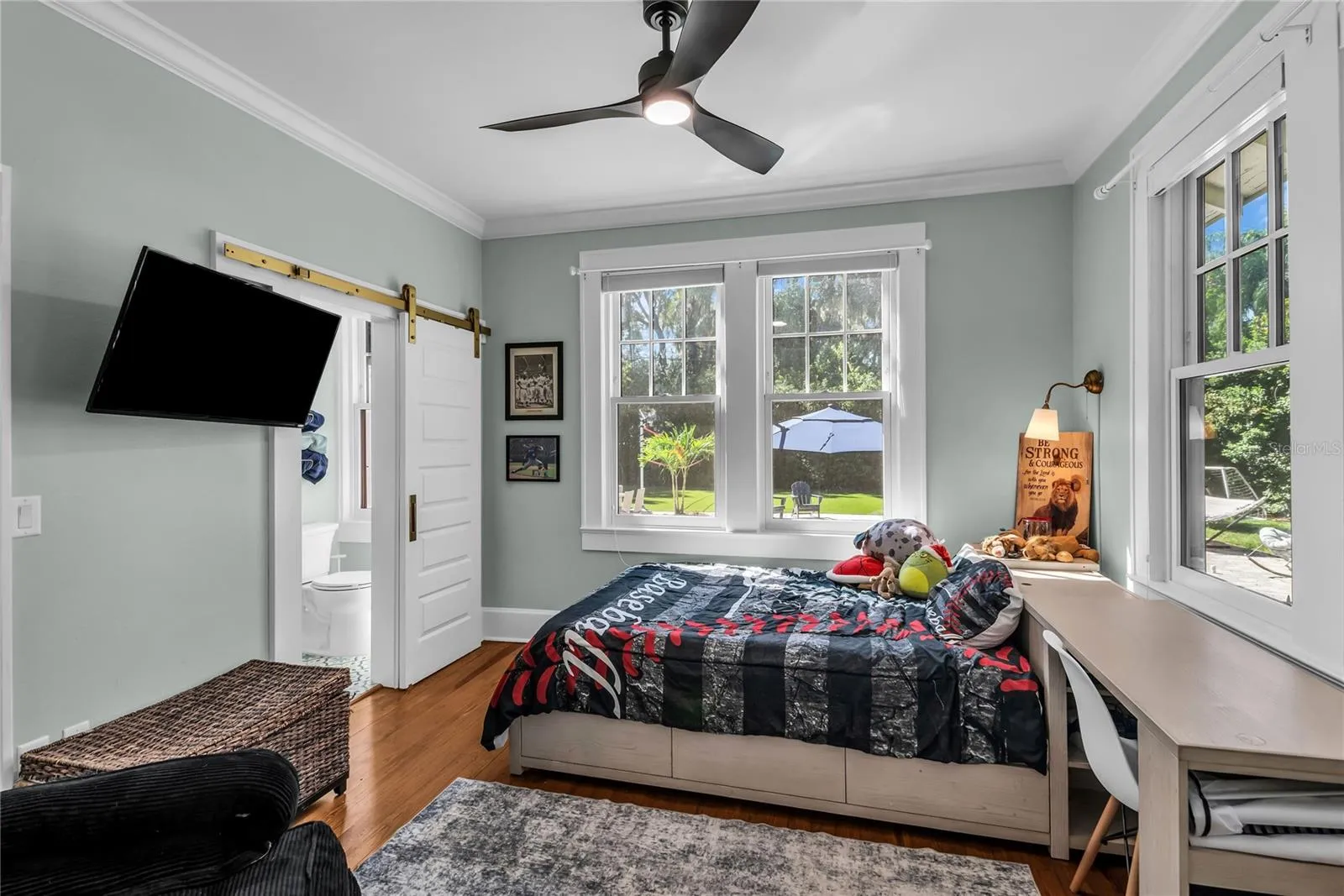 Bedroom 4 overlooks pool with ensuite bath