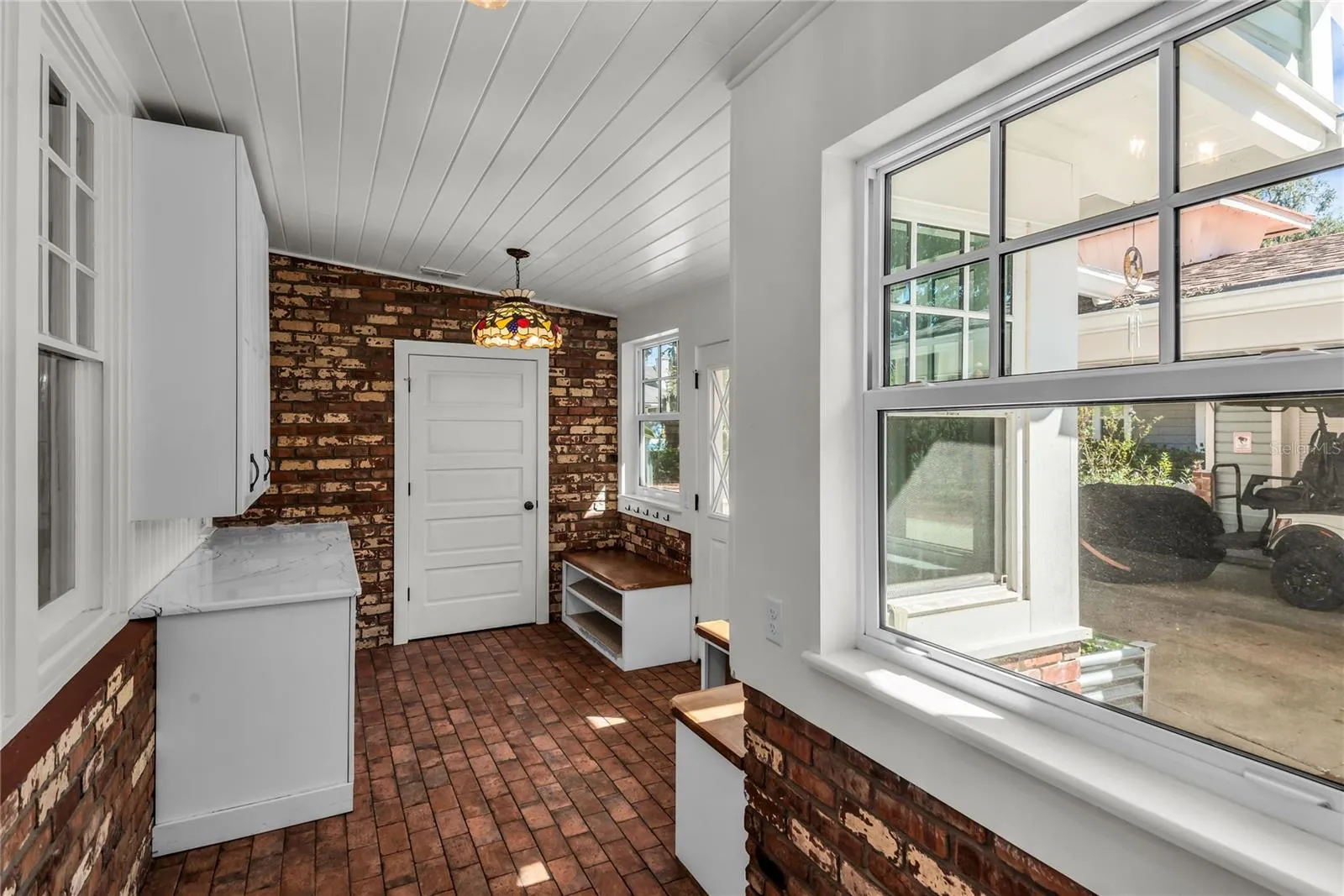 Spacious Mudroom provides entry to carport while a granite countertop, cabinets and a large closet offer both convenience and functionality