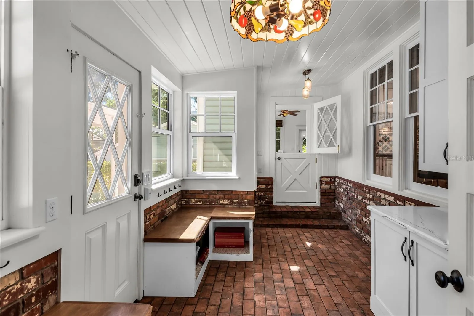 Spacious Mudroom provides entry to carport while a granite countertop, cabinets and a large closet offer both convenience and functionality