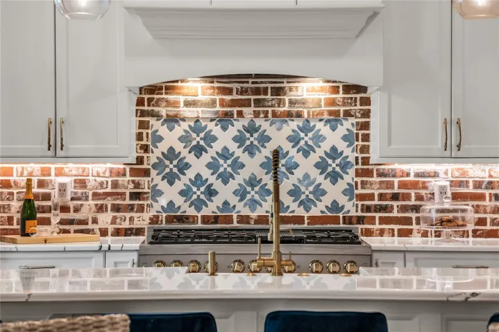 The chef's kitchen is a true focal point with a distinctive mix of old-world charm and modern design that combine luxury and function