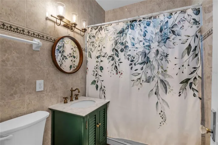 Guest Bath with standalone vanity and shower/tub combo