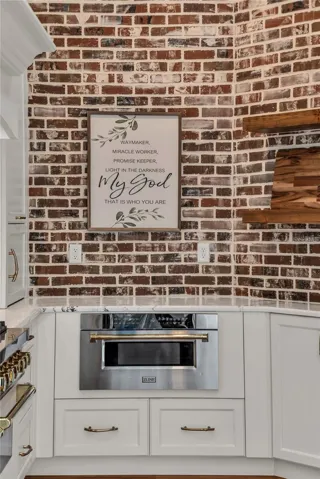 The chef's kitchen is a true focal point with a distinctive mix of old-world charm and modern design that combine luxury and function