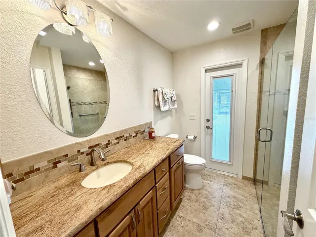 Guest Bathroom looking toward the pool door
