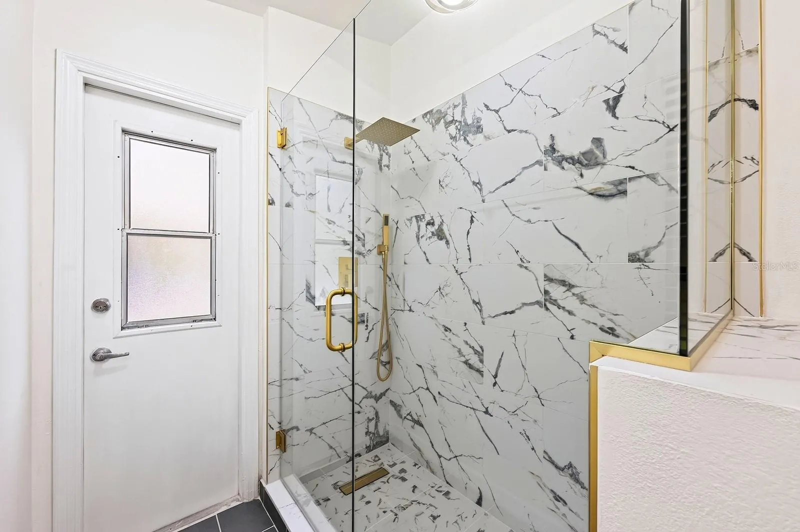The second full Bath, also COMPLETELY UPDATED IN 2026, features dual sinks, a walk-in shower and a convenient door leading directly to the pool area.