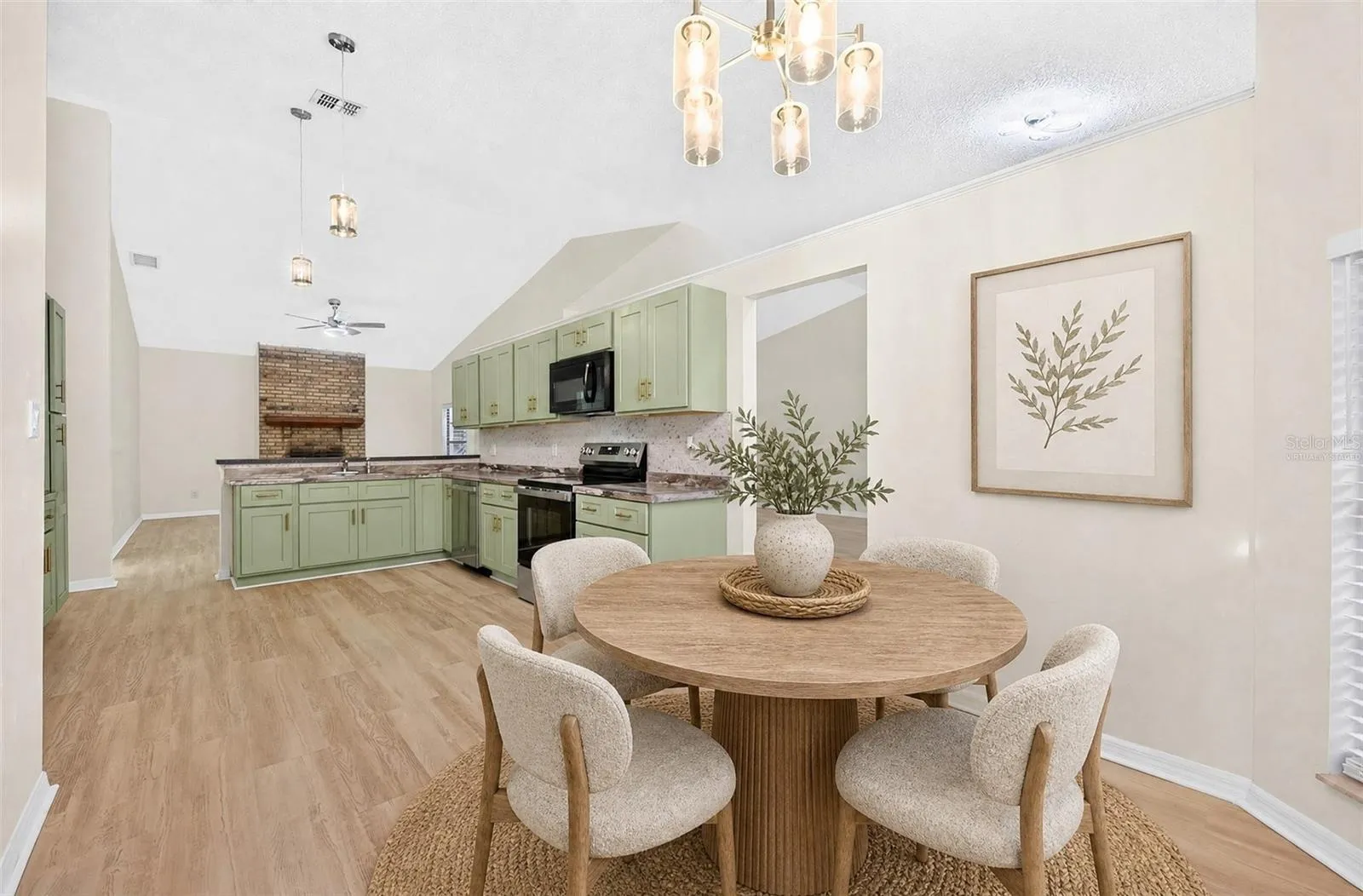 A sunny Breakfast Nook with its own ARCHED LUNETTE WINDOW provides a lovely spot for morning coffee. Virtually Staged