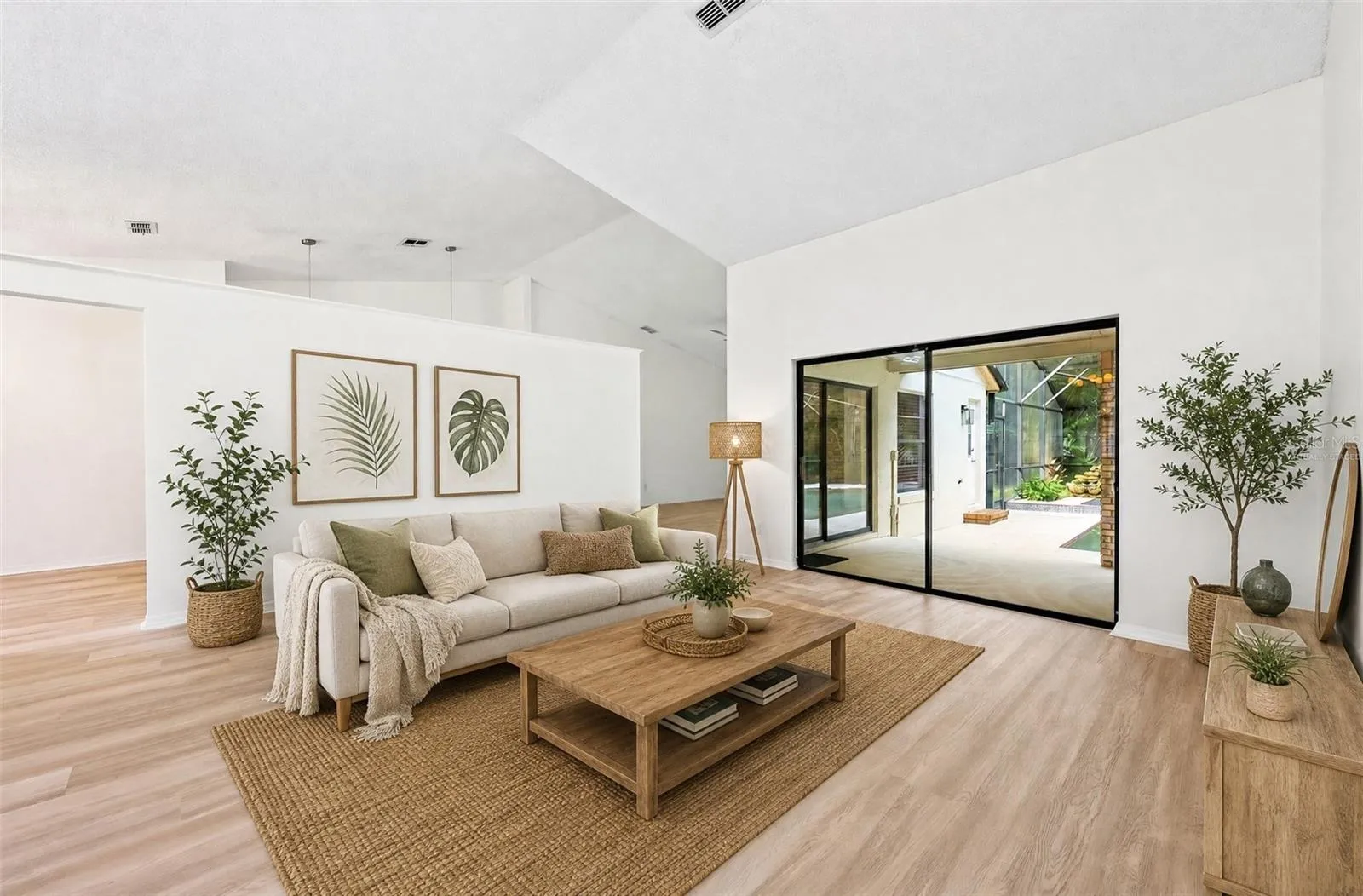 In the Living Room, sliding glass doors open to the PATIO AND POOL AREA—perfect for entertaining or enjoying a relaxed evening at home. Virtually Staged