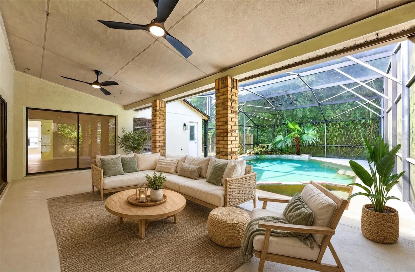 Sliding doors from the Family Room, Living Room and Primary Bedroom lead to the patio. Virtually Staged