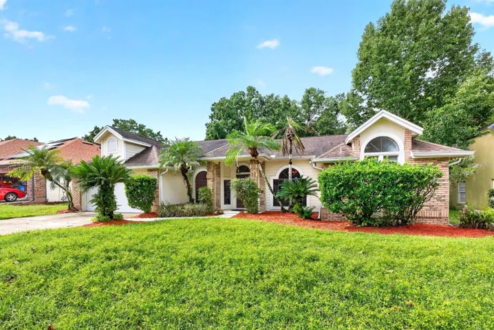 Welcome to this MOVE-IN READY POOL HOME in the sought-after Twin Rivers community of Oviedo!