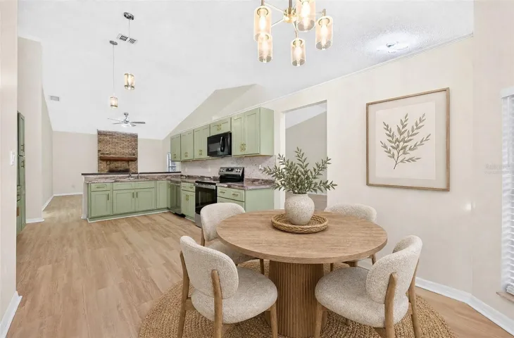 A sunny Breakfast Nook with its own ARCHED LUNETTE WINDOW provides a lovely spot for morning coffee. Virtually Staged