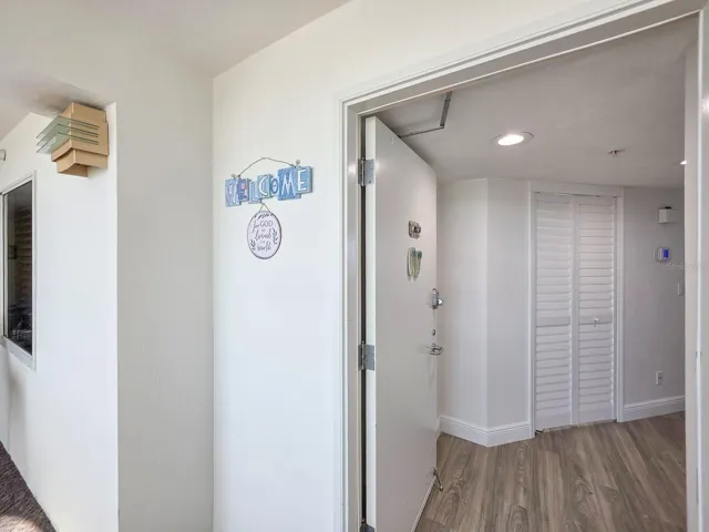 Welcome home.  Foyer view of hallway closet as you're entering paradise.